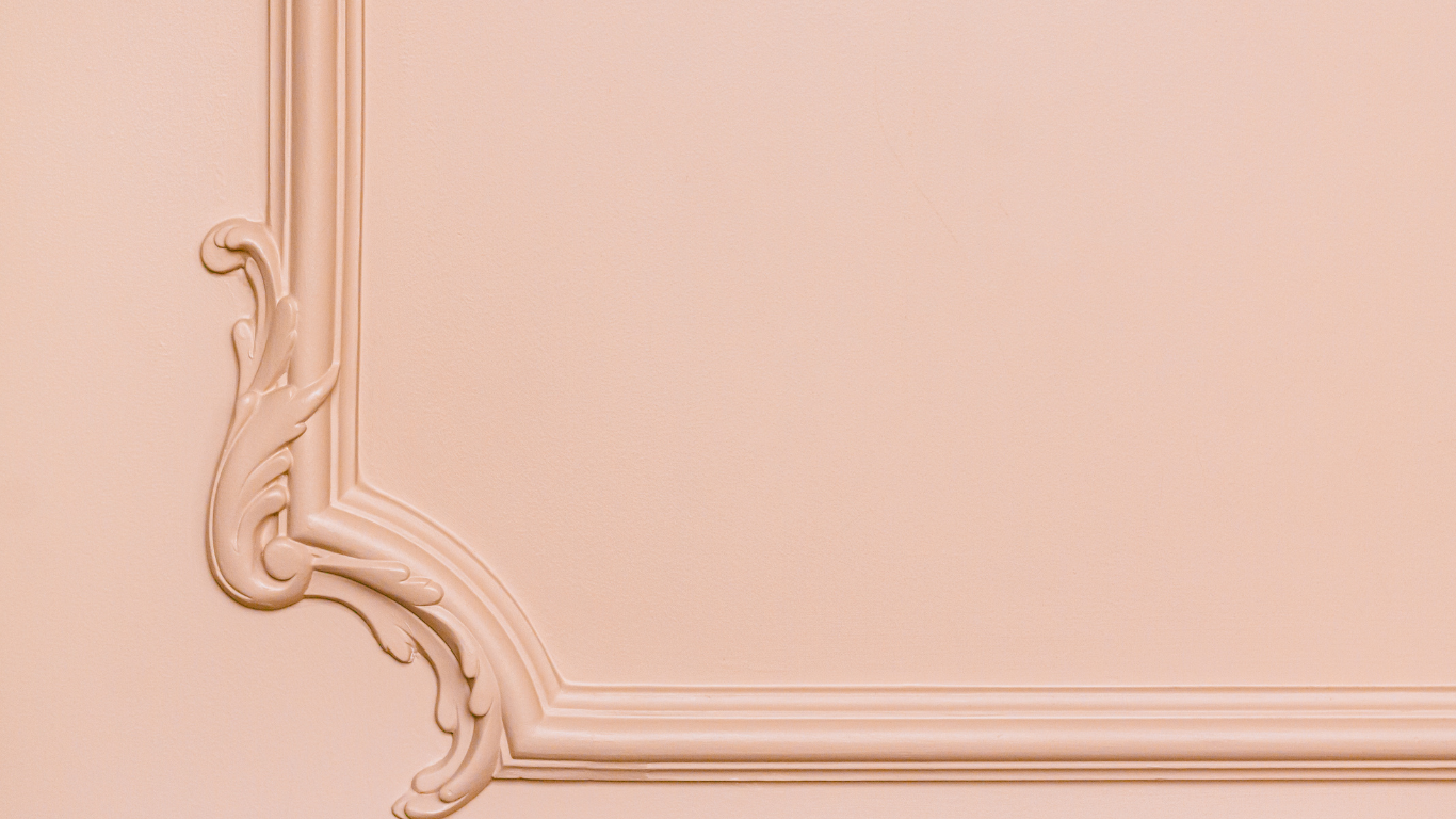 Exquisitely curved architectural moulding design in corner of wall.