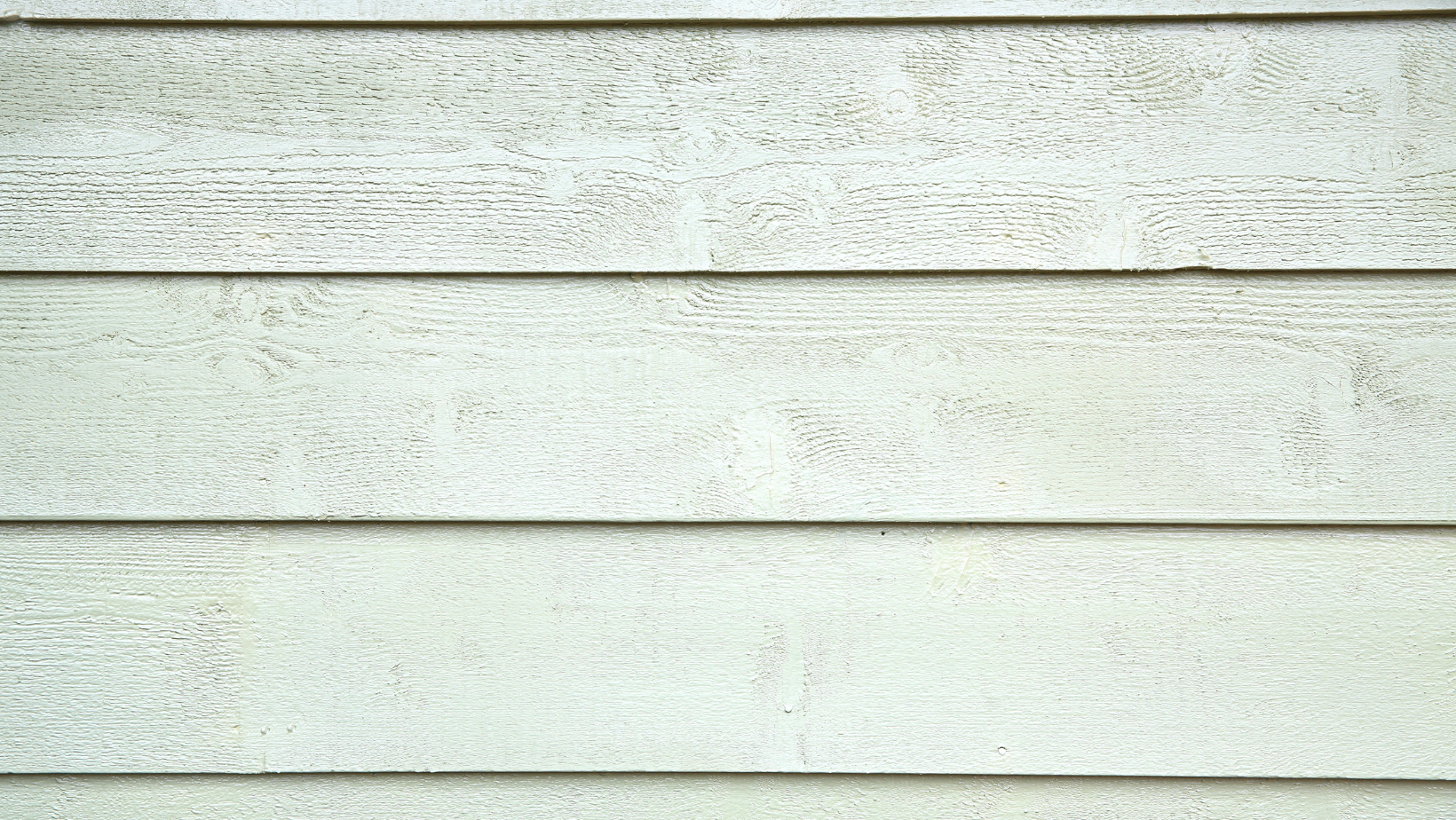 mint green painted cement fiber siding